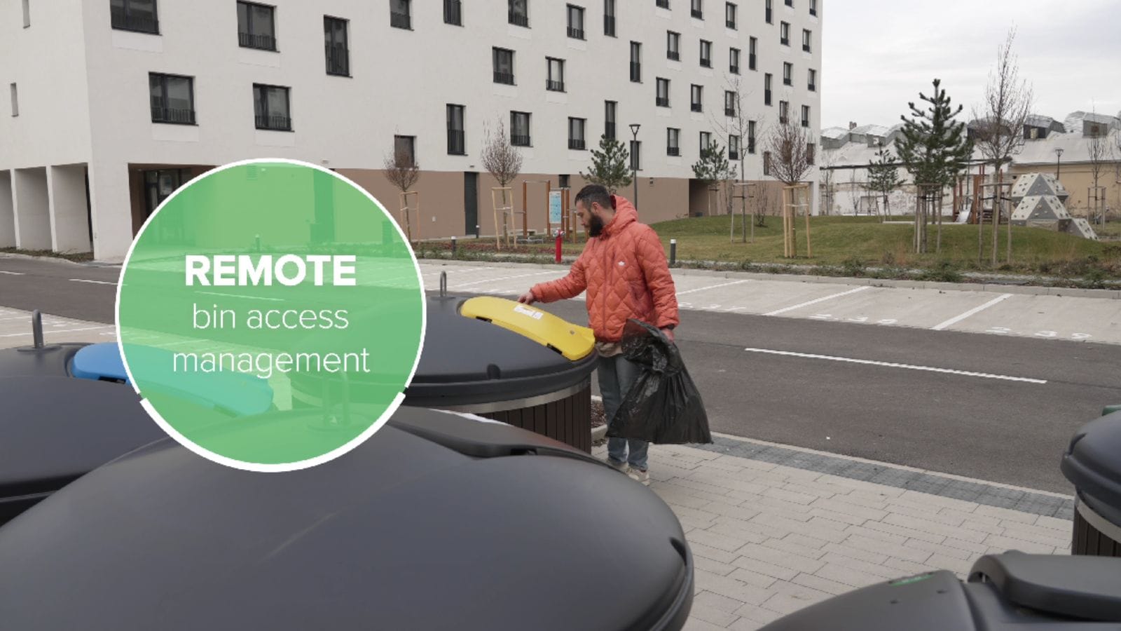 Man disposing of trash in a yellow-lid bin outside an apartment complex, with “Remote bin access management” text overlay.