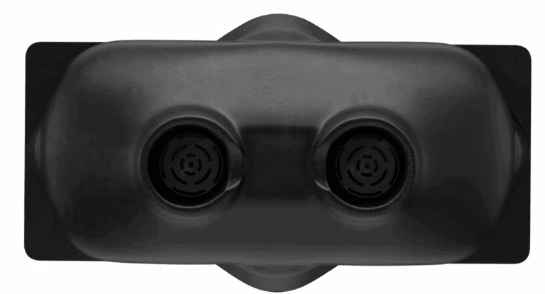 Close up view of a black ultrasonic bin sensor with dual circular components.