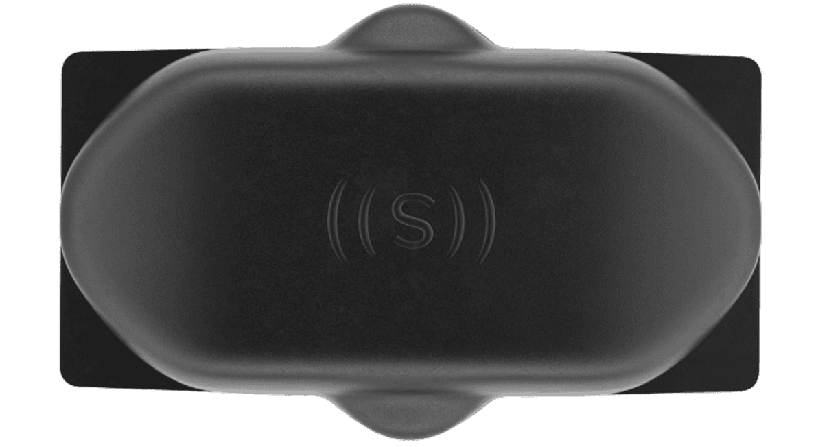 A top-down view of an ultrasonic sensor with the ((S)) logo on it.