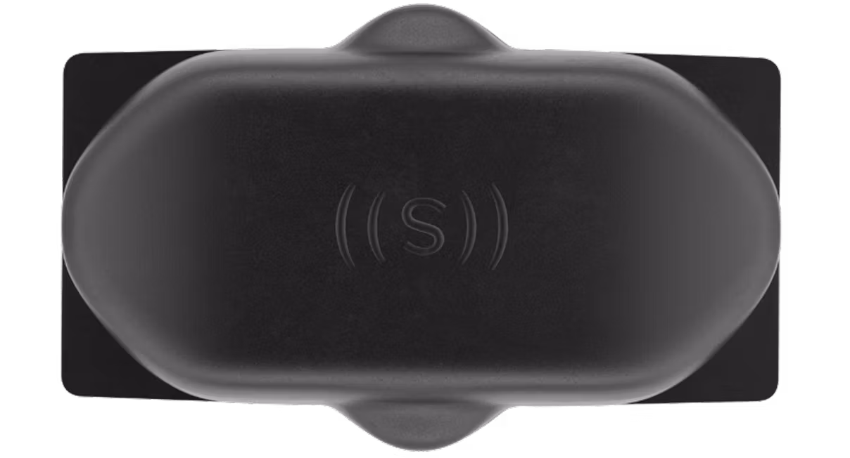 A top-down view of an ultrasonic sensor with the ((S)) logo on it.
