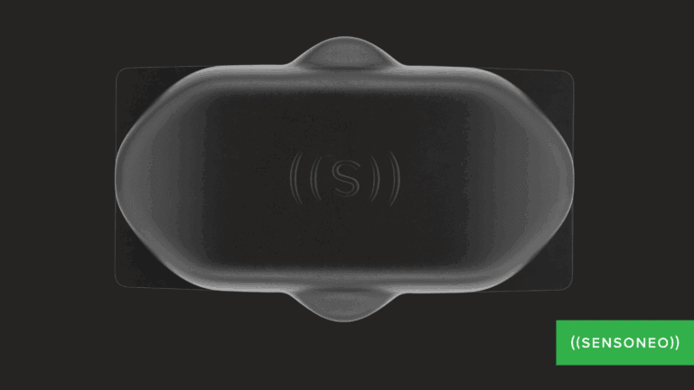 A close-up of a black sensor device with the "Sensoneo" logo.