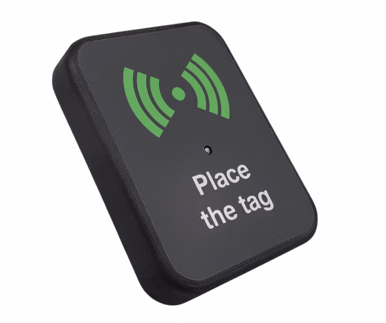 Compact RFID reader prompting users to place a tag for scanning.