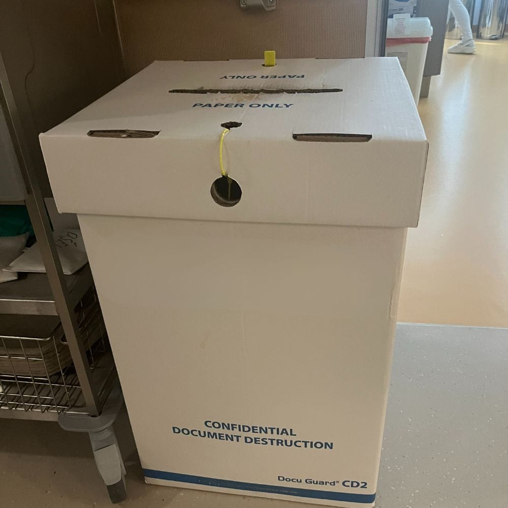 Locked bin for confidential paper document destruction.
