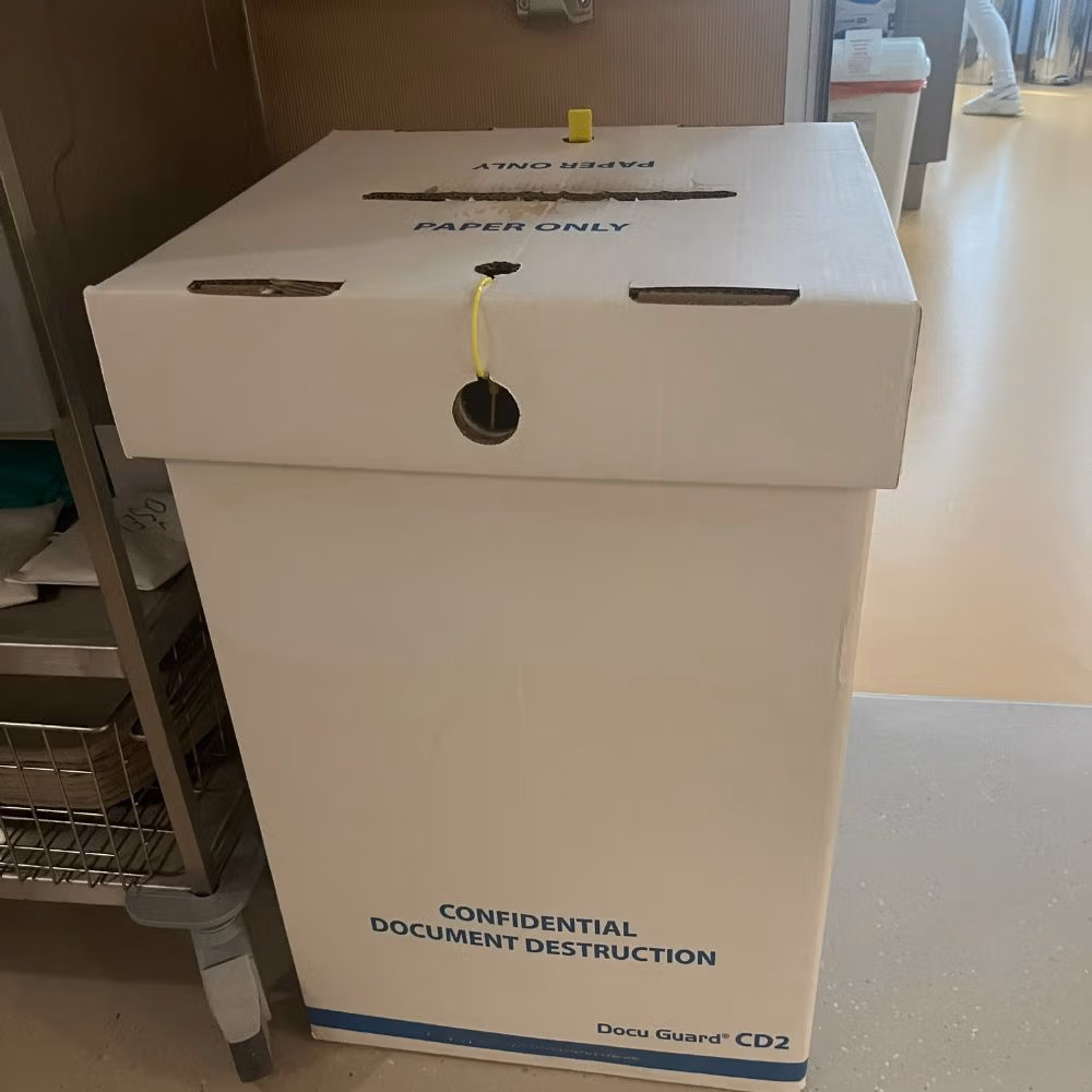 Locked bin for confidential paper document destruction.

