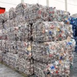 Large compressed bales of sorted plastic ready for recycling.