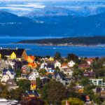 Small town near a mountain range and the sea.