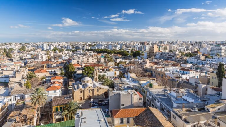 Modern cityscape blending dense urban buildings with historic architecture.