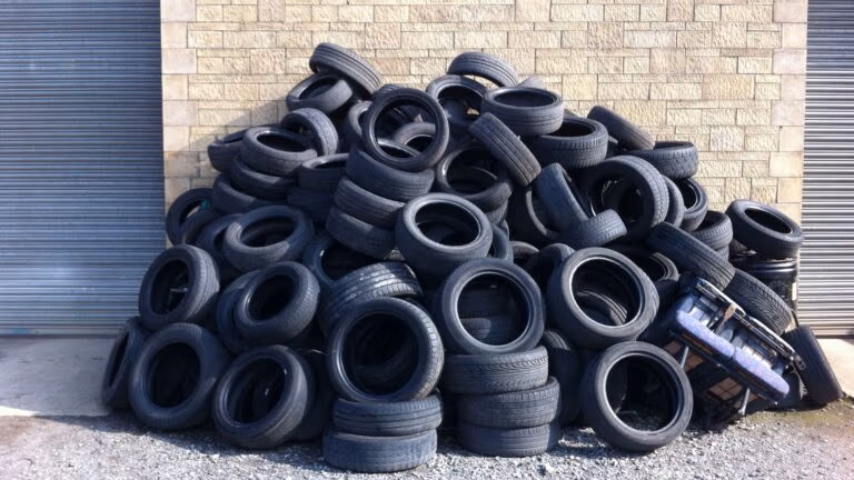 Large stack of used tyres.