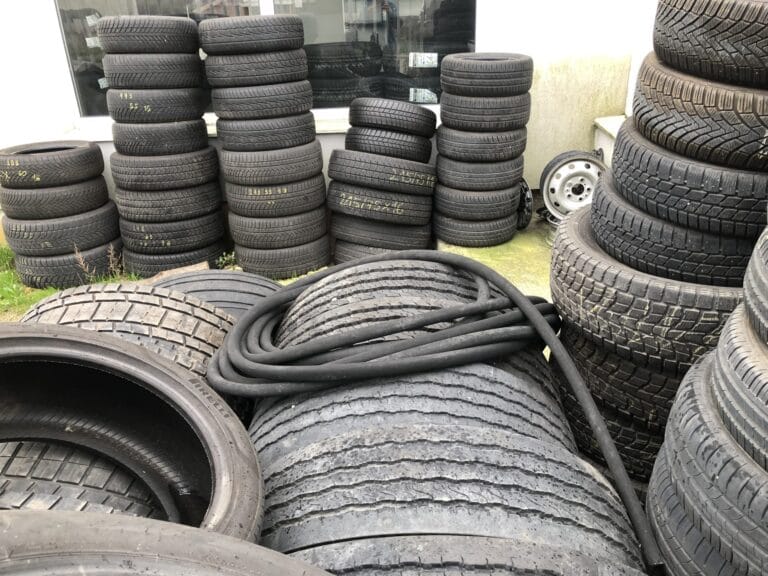 Stacks of used tires waiting for recycling or disposal.