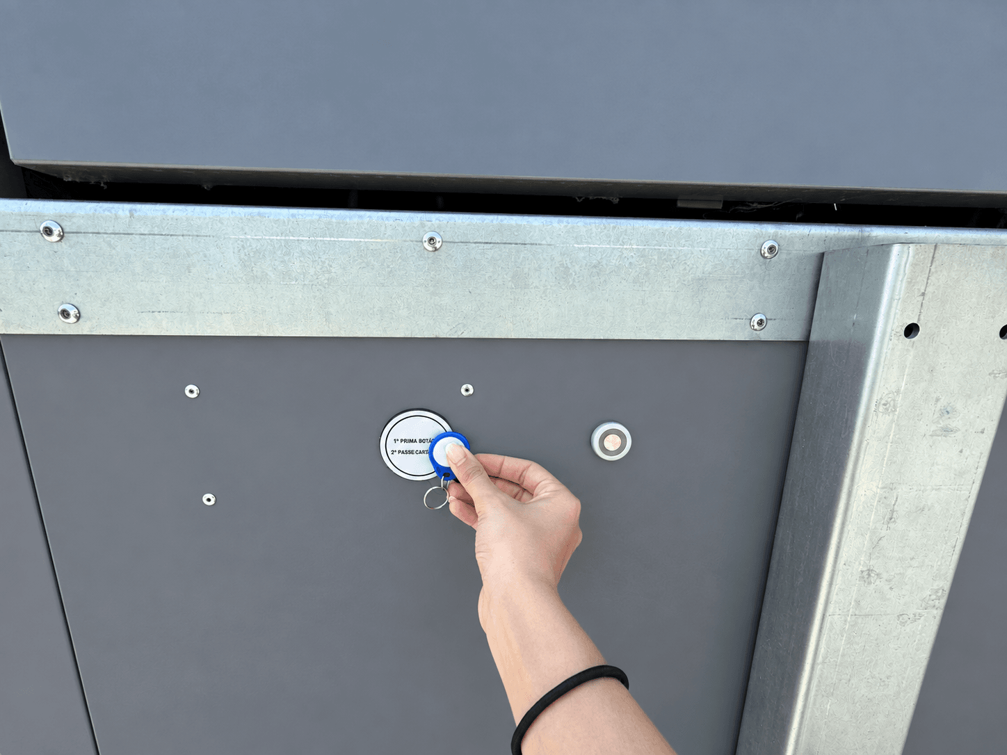 Authorised resident accessing a waste container with an RFID key fob